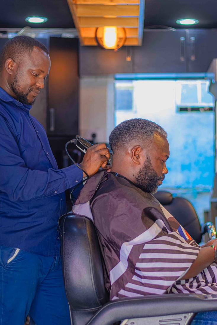 A client in the chair getting a neckline tidy-up