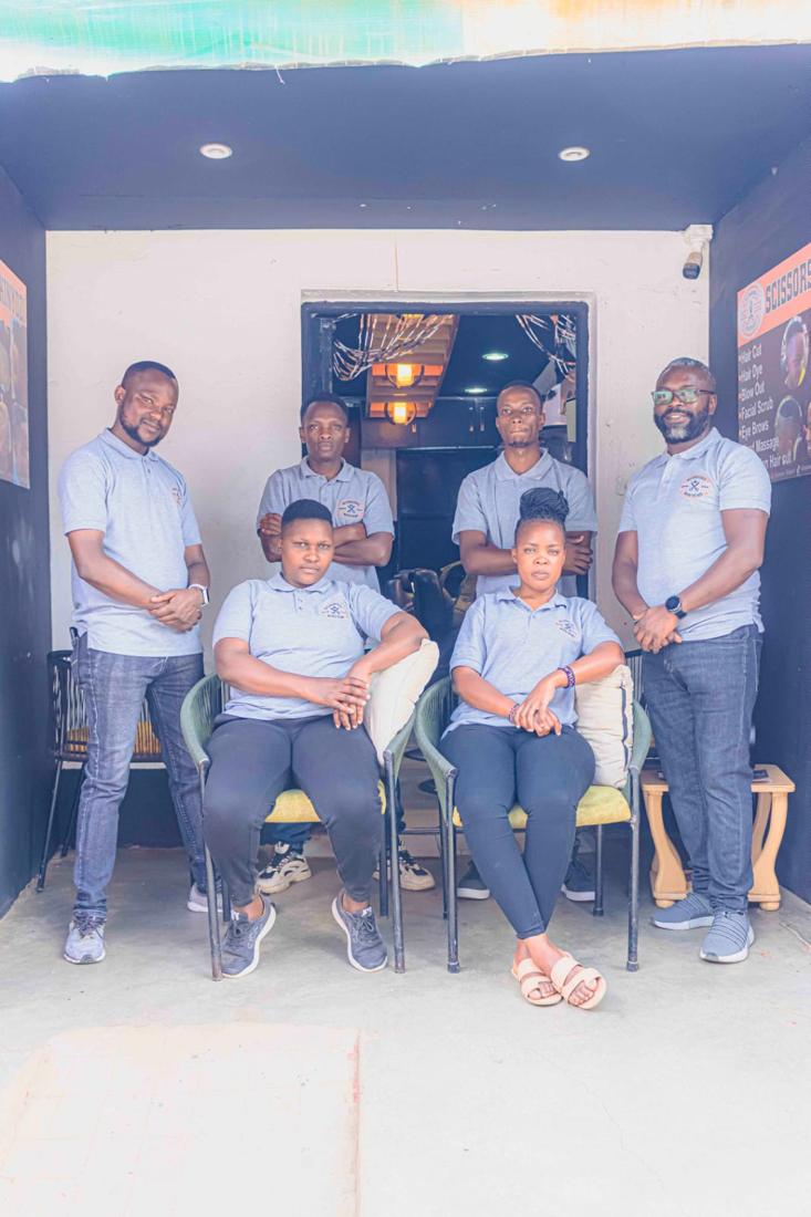 The Scissors Kinyozi team outside the shop in Nanyuki